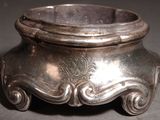 a silver bowl that is sitting on a table