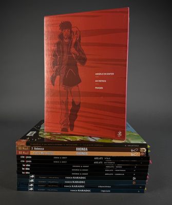 a stack of books sitting on top of each other on top of a table