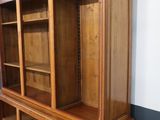 a large wooden bookcase with many shelves on it