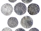six types différents de pièces d'argent sont représentés sur un fond blanc