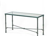 an image of a glass table with metal legs and a glass top