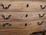a dresser that has a mirror on top of it