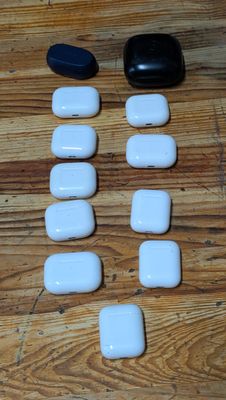 many white and black stones on a wooden floor