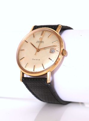 a close up of a wrist watch on a white surface