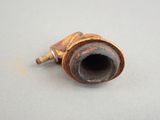 a rusted pipe that is sitting on a table