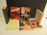 a lot of books that are sitting on a table