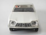 a toy car that is sitting on a white surface