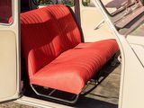 a red seat in the back of a white car