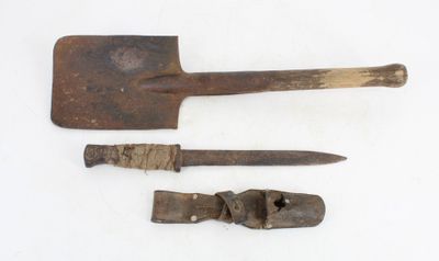 two old tools are sitting next to each other on a white surface