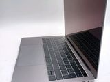 a close up of a laptop computer on a white surface