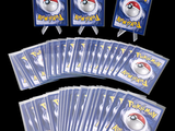 a lot of pokemon cards that are on the table