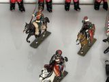 many figurines of soldiers on display in a display case