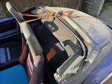 a car that has a seat belt attached to the back of it