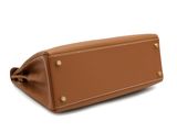 the large tan leather purse is open and ready to be used