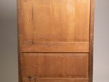 an old wooden chest with a drawer on top of it