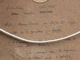 a piece of paper with writing on it sitting on a table