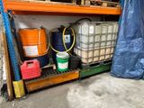 many barrels and containers on a shelf in a warehouse