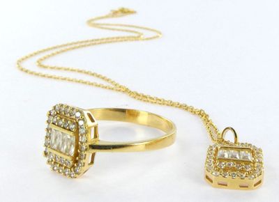 two pieces of jewelry including a necklace, ring, and pendant