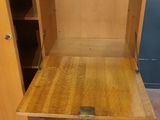 an image of a wooden cabinet with a drawer underneath it