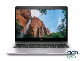 a laptop with a picture of a waterfall on the screen