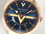 a watch that has a blue dial on it