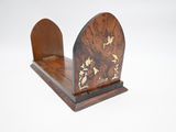 pair of wooden bookends with birds and flowers on them