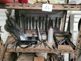 many tools that are sitting on a workbench in a garage