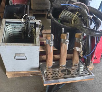 a bucket with a bunch of tools in it sitting on a pallet