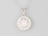 a white gold and diamond pendant on a chain