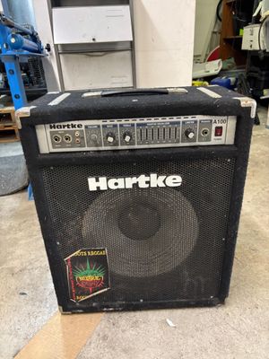 a black amp sitting on the floor in a room