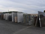 a lot of different types of granites on the side of the road