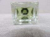 a small glass vase with a picture of a man on it