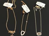 a group of three gold and diamond necklaces