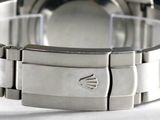 a close up of a watch on a table