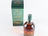 an image of a bottle of whisky sitting next to a box