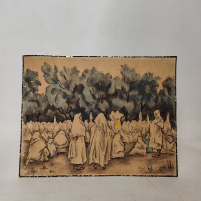 une vieille photo montrant un groupe de personnes assises dans un champ
