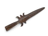 a close up of a rusty knife on a white surface