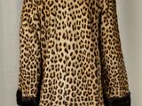 an image of a mannequin mannequin with a leopard print coat on it
