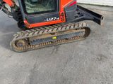 a picture of a small orange and black machine