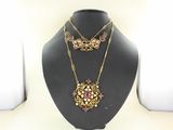 necklace and earring set in gold tone with pink and white stones