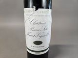 a bottle of wine that is sitting on a table