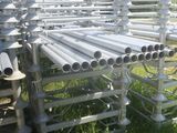a lot of pipes that are sitting in the grass