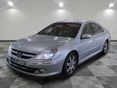 a picture of a silver car parked in a garage