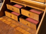 a wooden desk with drawers and a mirror in it