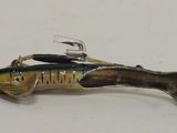 a small fish that is sitting on a fishing hook