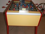 a foosball table in the corner of a room