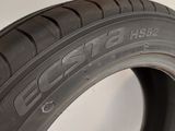 a close up of a tire on a white surface