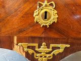 a wooden table with a brass plate on it