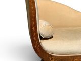 a chaise lounger with a pillow on top of it