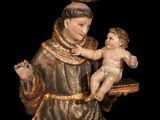 an image of a statue of a man holding a baby